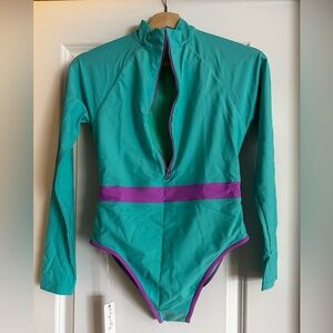 JOLYN NAZARE LONG SLEEVE ZIP-UP SURF ONE PIECE